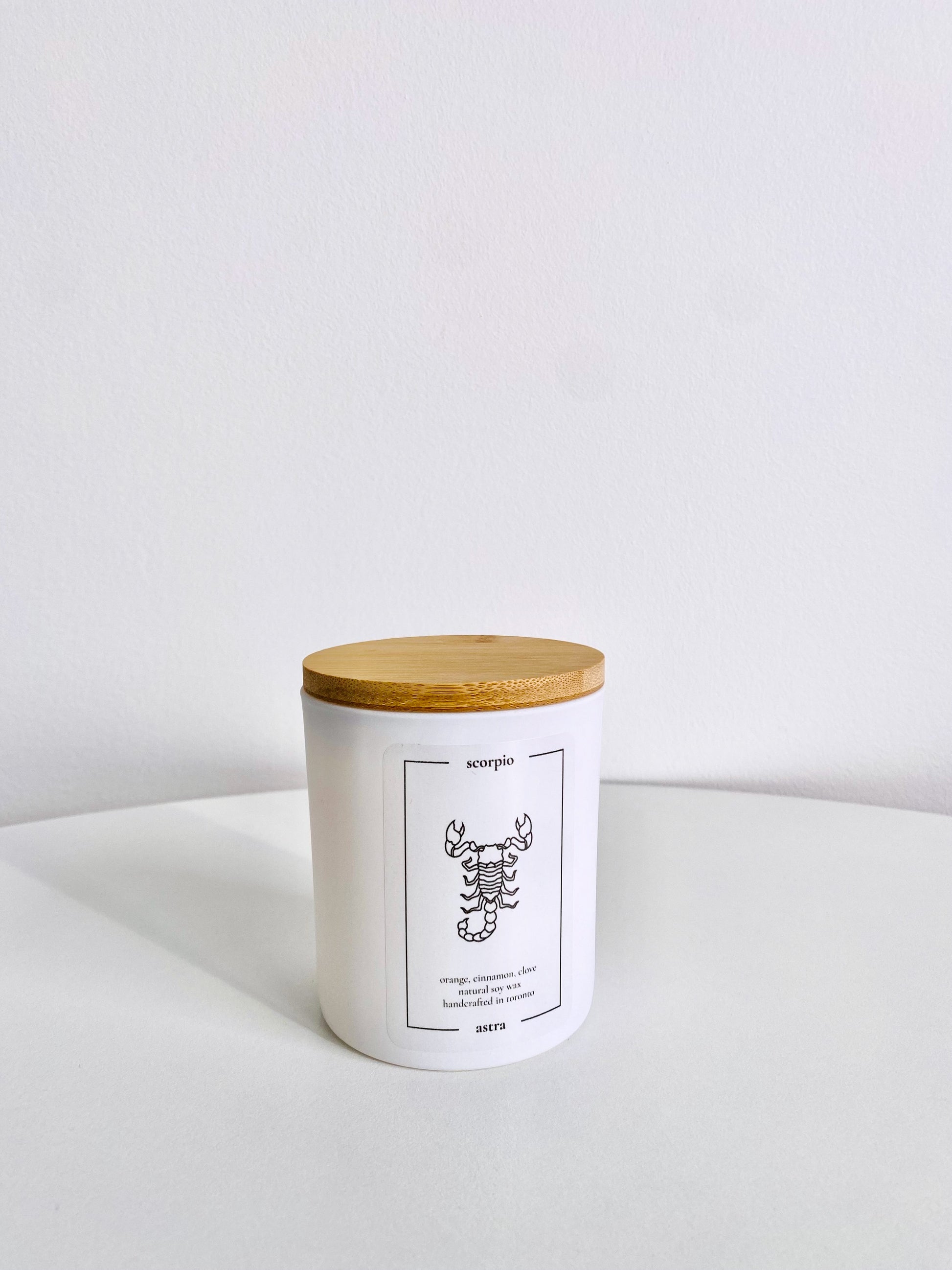 A Scorpio candle, depicting a scorpion, scented orange, cinnamon and clove